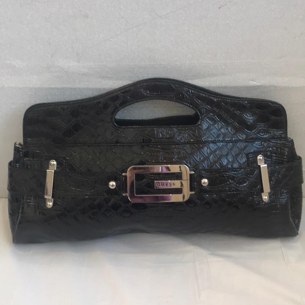 Guess oversize black clutch with textured design.